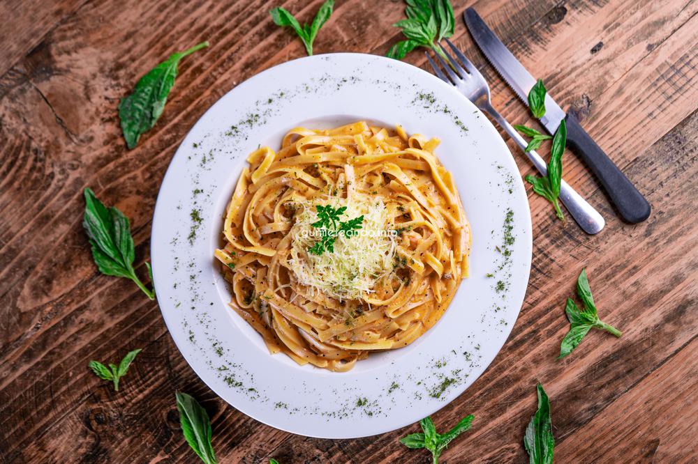 top-view-of-cheesy-pasta-on-white-plate